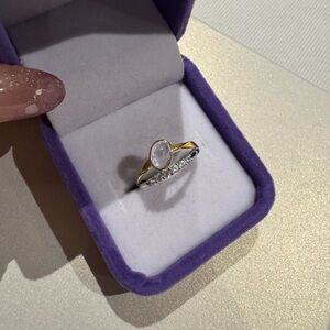 Moonstone on gold plated band and diamond cz on 925 silver setting

Adjustable
